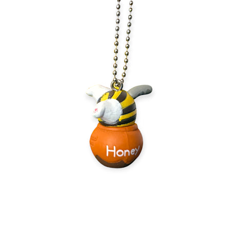 Bumblebee character keychain holding a Honey pot