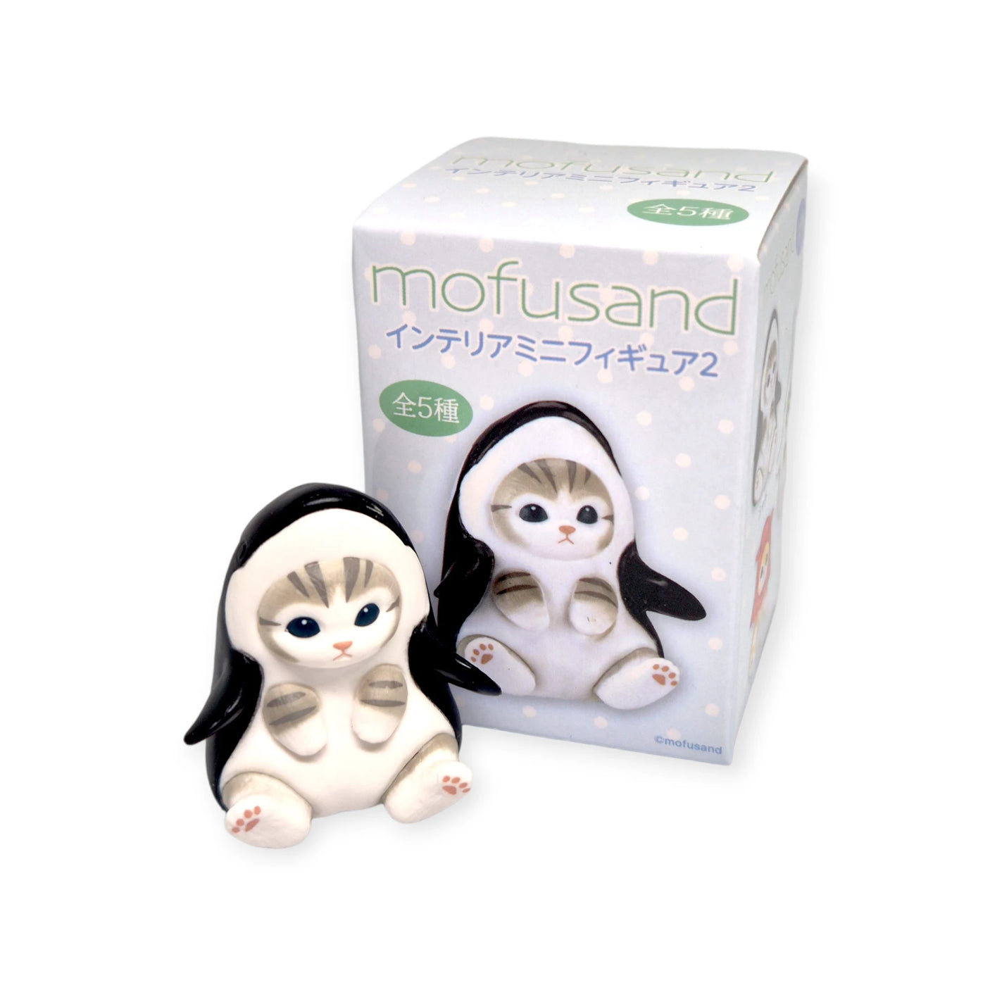 A delightful Mofusand Mini Figure from the Vol 2 (Blue) series showcases a cat cutely dressed in a penguin sea creature costume, displayed in front of its "Mofusand" branded blind box packaging.