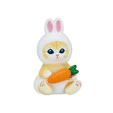 A charming collectible from the Mofusand Mini Figure Blind Box - Vol 3 (Pink) series features a cat figurine clad in a bunny costume, holding a carrot, and set against a simple white background.