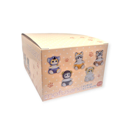 A cardboard box adorned with cartoon animal figures in various poses, displaying "Mofusand" prominently on the front, is an appealing Mofusand Mini Figure Blind Box - Vol 4 (Orange). Inside, collectors might find a charming Mofusand Mini Figure, possibly even a costumed kitty that is sure to surprise and delight.