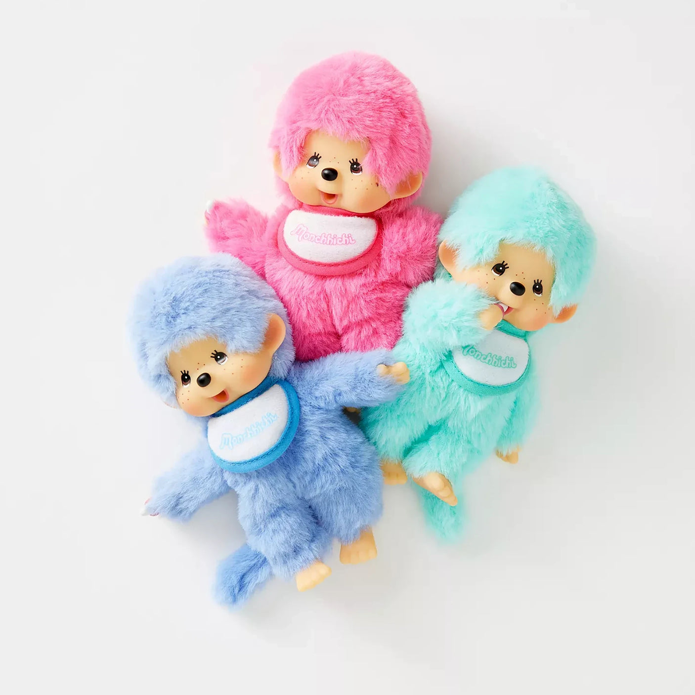 Set of three plush dolls: pink, light blue, and mint with matching bibs