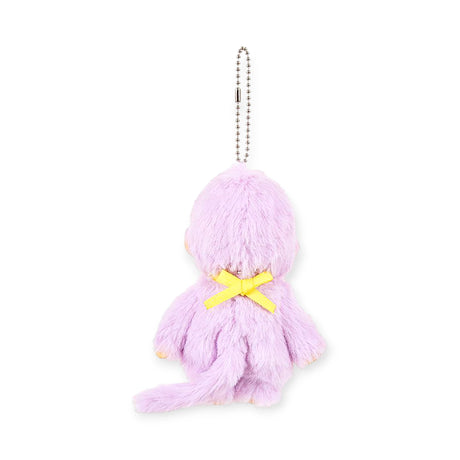 The Monchhichi Colours Bag Charm - Purple by Monchhichi is a small, plush animal keychain with a yellow bow on its back—a charming accessory or gift.