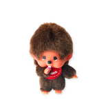 Brown plush Monchhichi boy bag charm with red shirt, smiling face, big furry head