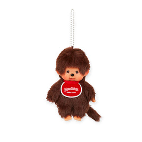 Monchhichi Boy plush bag charm with brown fur and red bib hanging from silver ball chain keychain