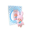 A charming Monchhichi Flocked Figure Blind Box from the Chimutan Series, featuring a pink design with rabbit ears, sits beside its matching packaging.