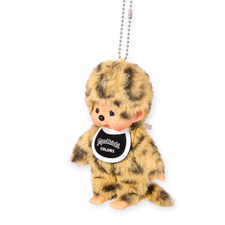 Leopard-pattern plush bag charm with beaded chain and round “Monchhichi COLORS” tag