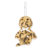 Leopard-pattern plush bag charm with beaded chain, back bow, and “Monchhichi COLORS” badge
