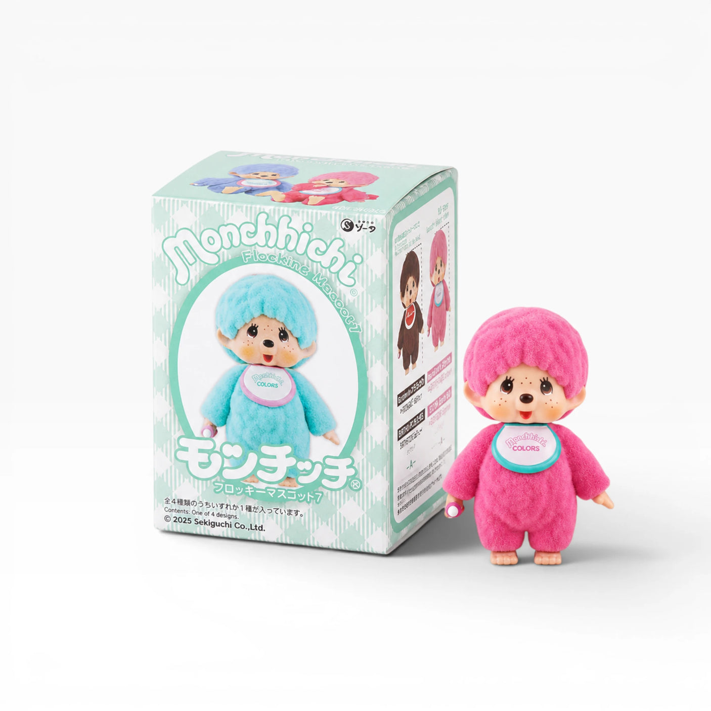 Monchhichi flocked figure in pink with hood, standing beside blind box