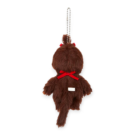 Rear view of Monchhichi Girl bag charm with soft brown fur, red bow on head and back, hanging from silver ball chain