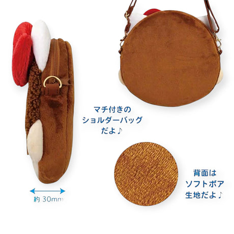 Exclusively in Japan, the Monchhichi x Hello Kitty Shoulder Bag by Monchhichi is a soft, brown, round plush bag with red and white ear-like details and about 30mm thickness. Japanese text showcases its special design.
