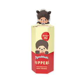 Monchhichi Hippers Blind Box Series with brown-haired figure peeking over yellow and red box, gallery image one