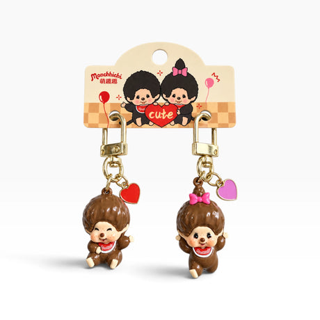 2-pack Monchhichi mini charms with gold clips and brown figure keychains, heart & bow accents
