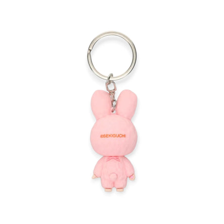 Pink bunny mini figure keychain with 'SEKIGUCHI' text on the back