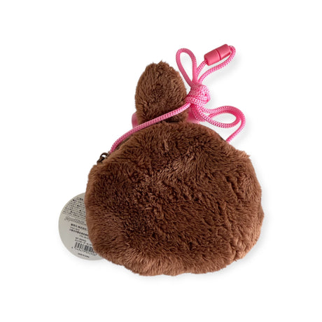 The Monchhichi Mini Bag with strap - Girl is a plush, paw-shaped brown coin purse featuring a soft texture and playful pink rope. This adorable Monchhichi creation is both charming and functional for carrying small essentials.