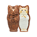 The Kitan Club's Mummy Cat Blind Box is a two-part chocolate sculpture, with one half featuring an ornate sarcophagus and the other revealing the hidden wrapped feline inside, mimicking the experience of opening a sweet blind box.