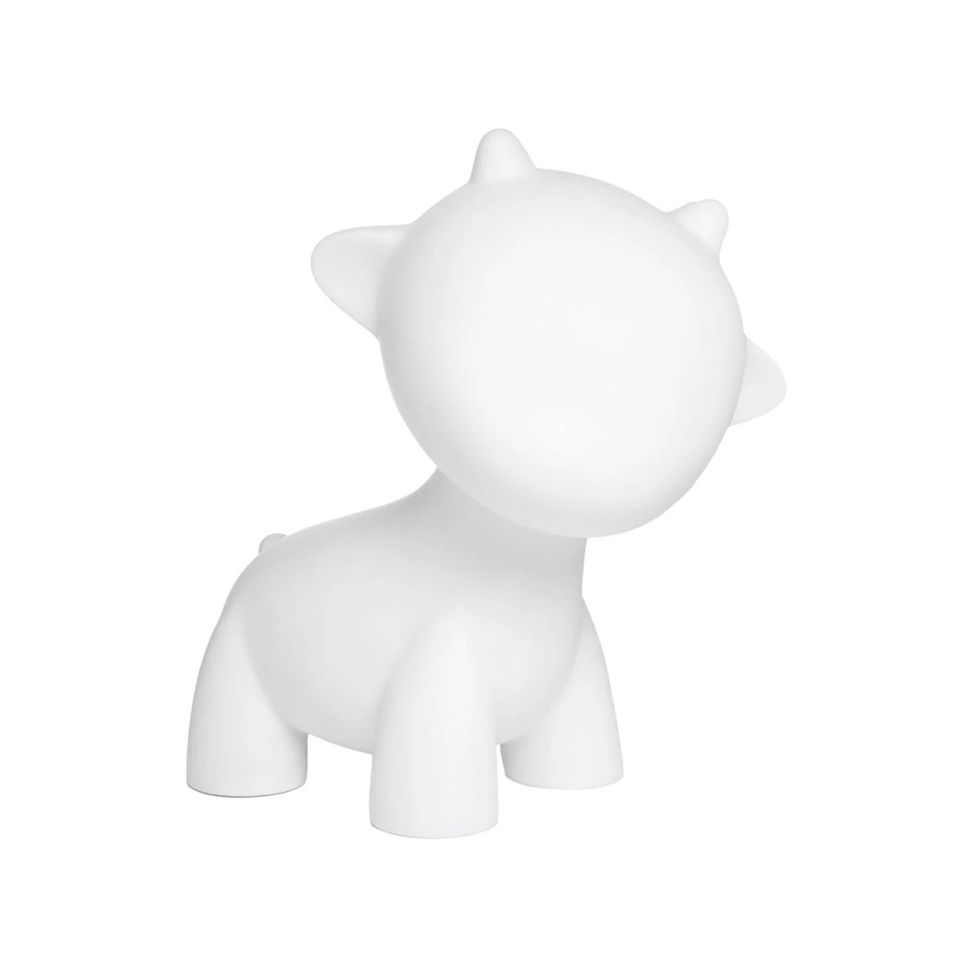 White abstract cow figurine inspired by the Kidrobot Munnyworld DIY Personalised Pop Vinyl mini figure, showcasing simplified features and rounded shapes against a plain backdrop.