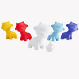 A collection of five vibrant Munnyworld - DIY Personalised Pop Vinyl mini figures by Kidrobot, alongside a small paint pot, are set against a white background, evoking the essence of creativity and customization.