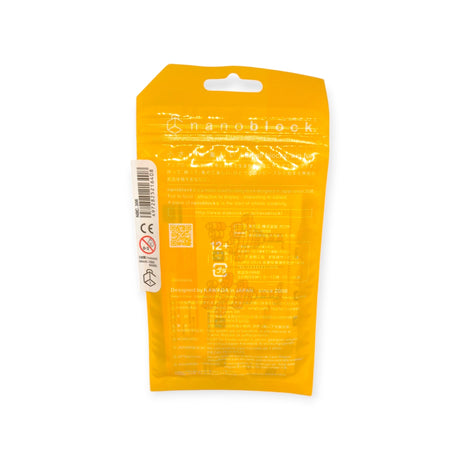 Back view of a yellow Nanoblock Lollipop packaging from the Nanoblock brand, highlighting product details, an age recommendation of 12+, and safety instructions in various languages for these delightful miniature building blocks.