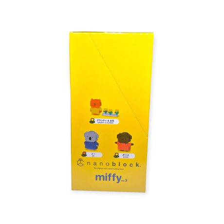 The Nanoblock Miffy Blind Bag - Vol. 3 comes in yellow packaging that showcases small brick figures of Miffy and her friends, complete with text and illustrations on the box. Collect all the adorable Miffy figures in this enchanting series from Nanoblock.