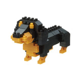 Using the Nanoblock Dachshund kit by Nanoblock, this small, blocky toy model of a Miniature Dachshund is made from black and brown interlocking bricks, showcasing the intricate detail achievable with this set against a white background.