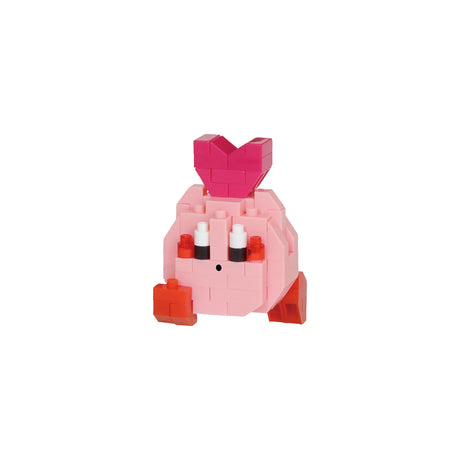 The Nanoblock Kirby Blind Bag - Vol. 2 series presents a petite pink block figure adorned with white and orange accents, highlighted by a heart shape on top. Part of the whimsical world crafted by Nanoblock, this delightful model showcases intricate detail that captures its enchanting essence.