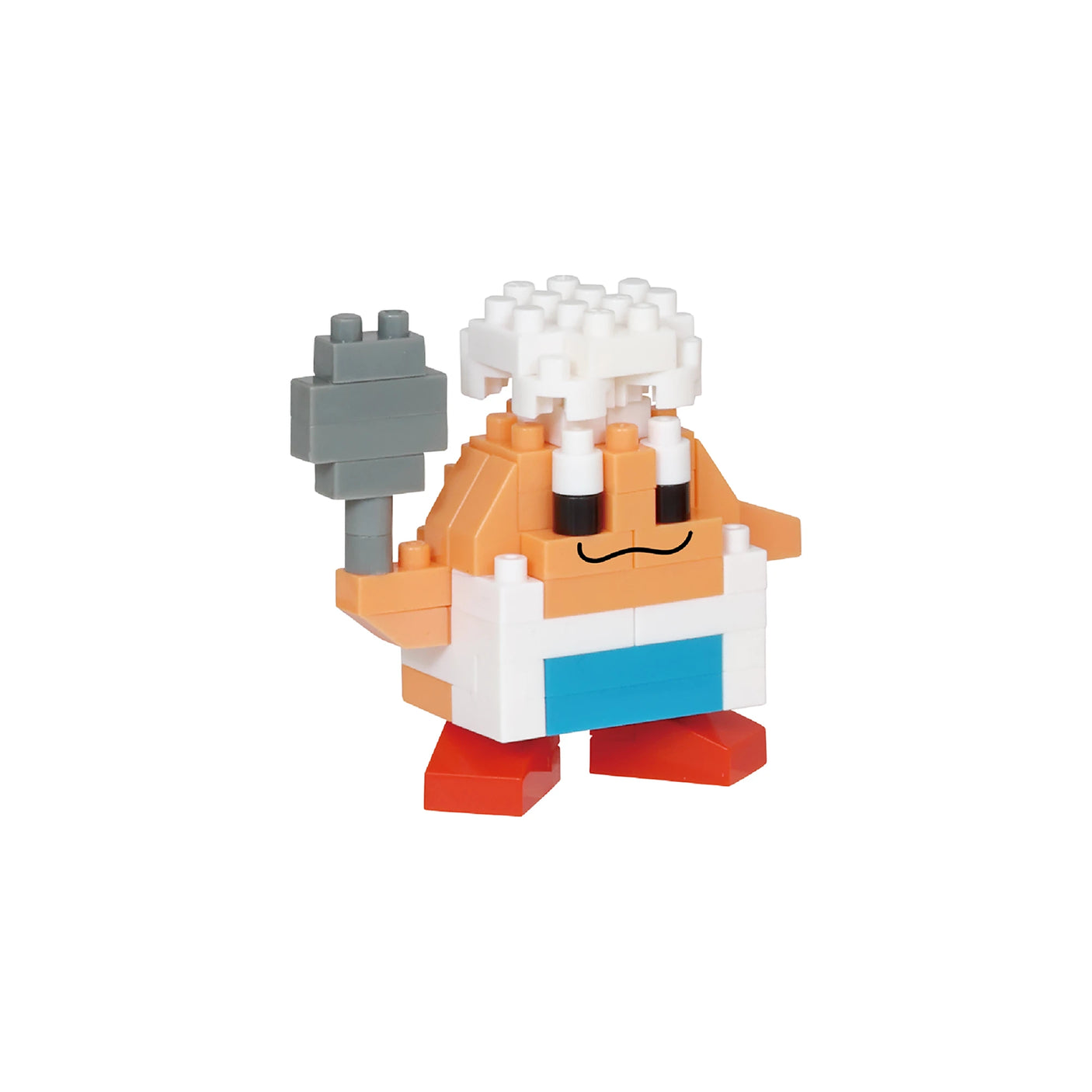 A blocky toy figure from the Nanoblock Kirby Blind Bag - Vol. 2 series features a chef's hat, a white apron, and a gray spatula, all standing on bold red feet.