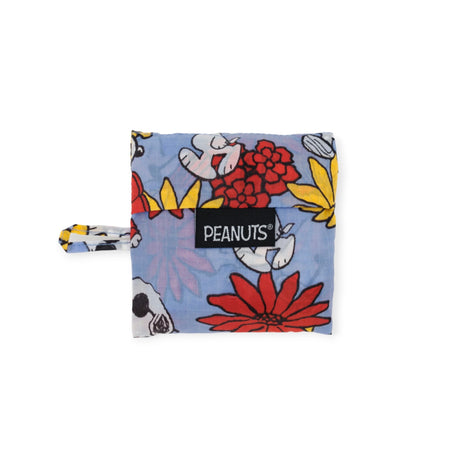 The Baby Baggu Peanuts - Floral Snoopy from Baggu is an adorable small fabric pouch adorned with Peanuts characters and a lively floral Snoopy motif. Made from recycled nylon, it showcases a whimsical Peanuts logo tag, making it ideal for admirers of Baby Baggu collectibles.