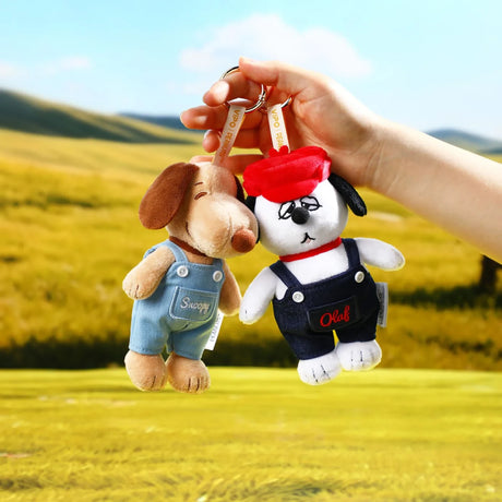 Plush denim keychains of Olaf and a brown dog with metal key rings