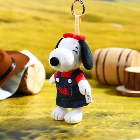 Plush Snoopy denim keychain in navy overalls with red scarf, metal key ring