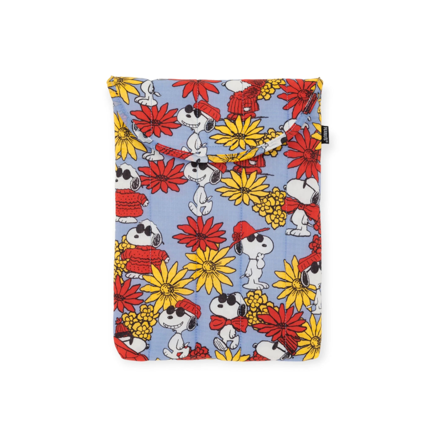 The Peanuts x Baggu Laptop Sleeve - Snoopy Floral 13"/14" showcases Snoopy adorned in a red scarf and hat, set amidst bright red and yellow flowers. This Baggu product is crafted from 100% recycled materials, merging eco-consciousness with an endearing Snoopy floral design.