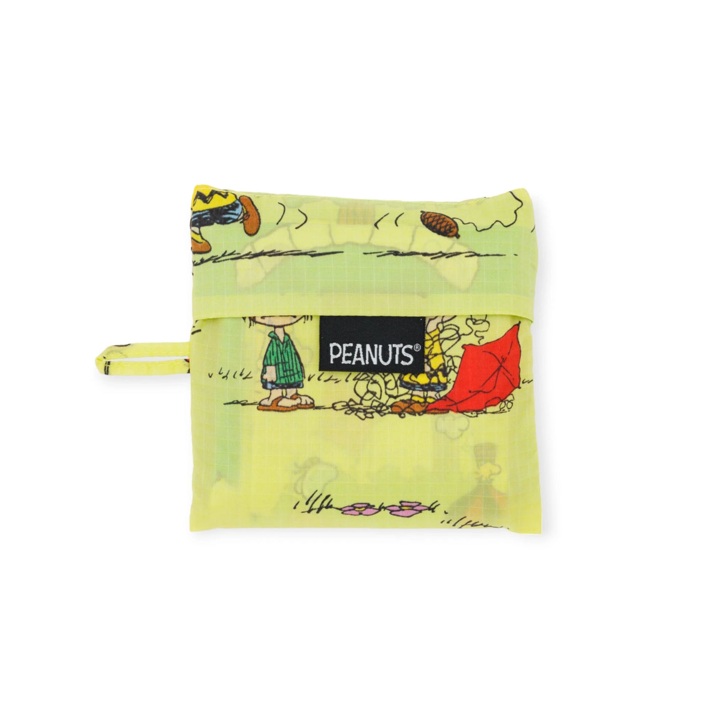 A compact yellow Baggu Standard pouch adorned with eco-friendly Peanuts Kite Eating Tree illustrations, complete with a "Peanuts" label on the front.