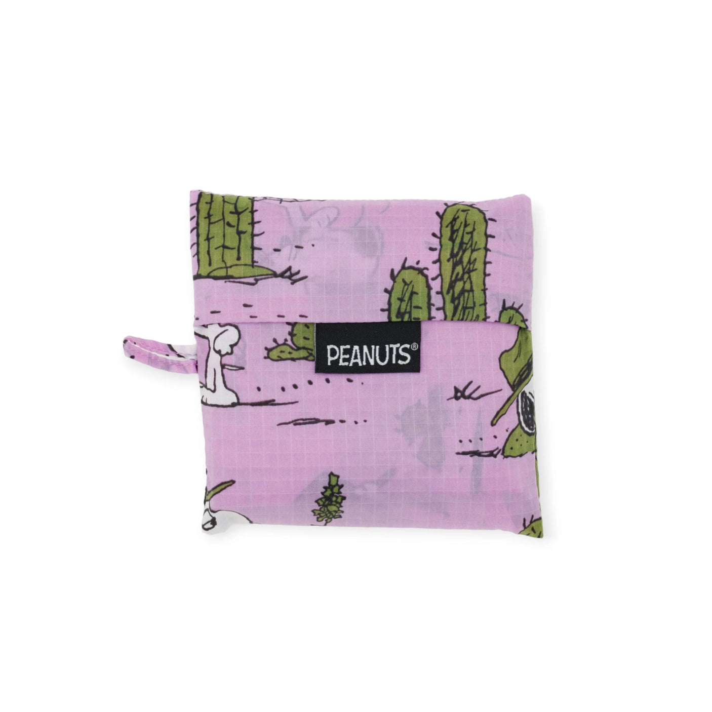 The Baggu Standard - Peanuts Pink Spike is a compact, square pouch adorned with a pink Peanuts-themed design, showcasing cacti and desert elements. It is made from eco-friendly materials and includes a labeled flap closure.