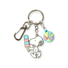 Snoopy holding a pastel ice cream cone and a colorful beach ball charm on a silver keyring with clasp attachment