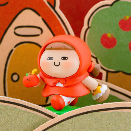 Orange hood blind-box figurine holding a small white bottle, with tiny red character.