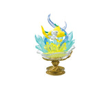 The Re-Ment Pokemon Gemstone Collection 2 features an enchanting decorative figure of a yellow and white Pokémon character, beautifully surrounded by translucent blue and yellow crystals and elegantly placed on a golden pedestal. This piece perfectly captures the essence of the Pokémon Gemstone collections.