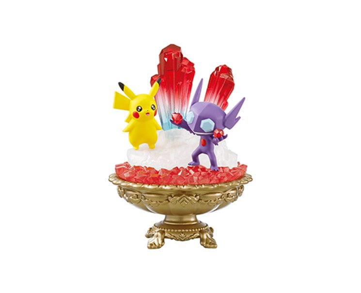 The Re-Ment Pokemon Gemstone Collection 2 features a Pikachu and Sableye figurine set on an ornate base embellished with red crystals.