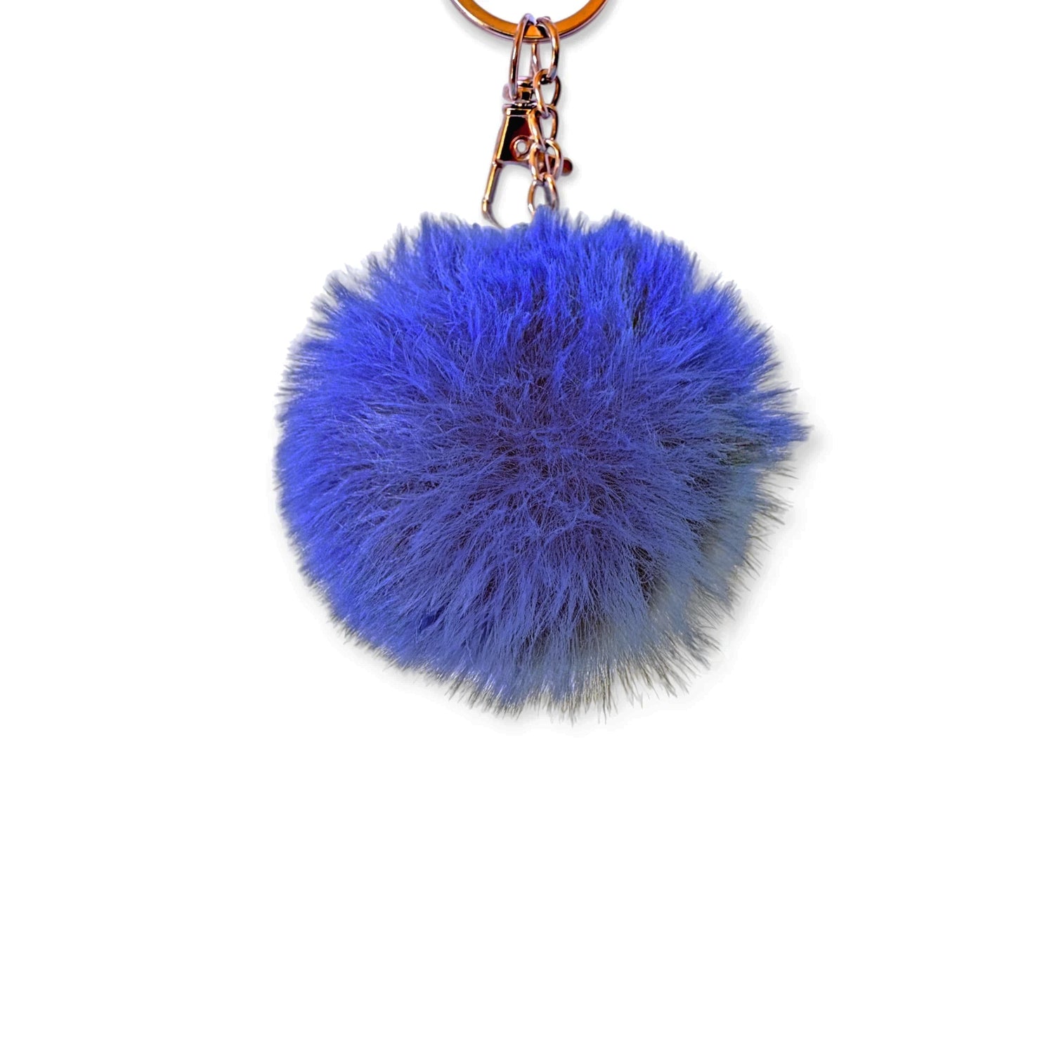 Fluffy royal blue pom pom bag charm with gold lobster claw clip, perfect for adding texture and color to accessories.