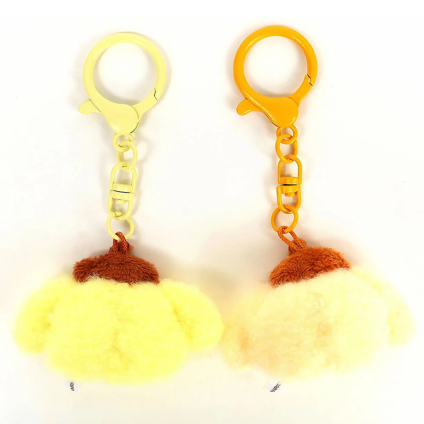 Mini plush keychains (2): yellow plush with brown cap and orange/yellow key rings