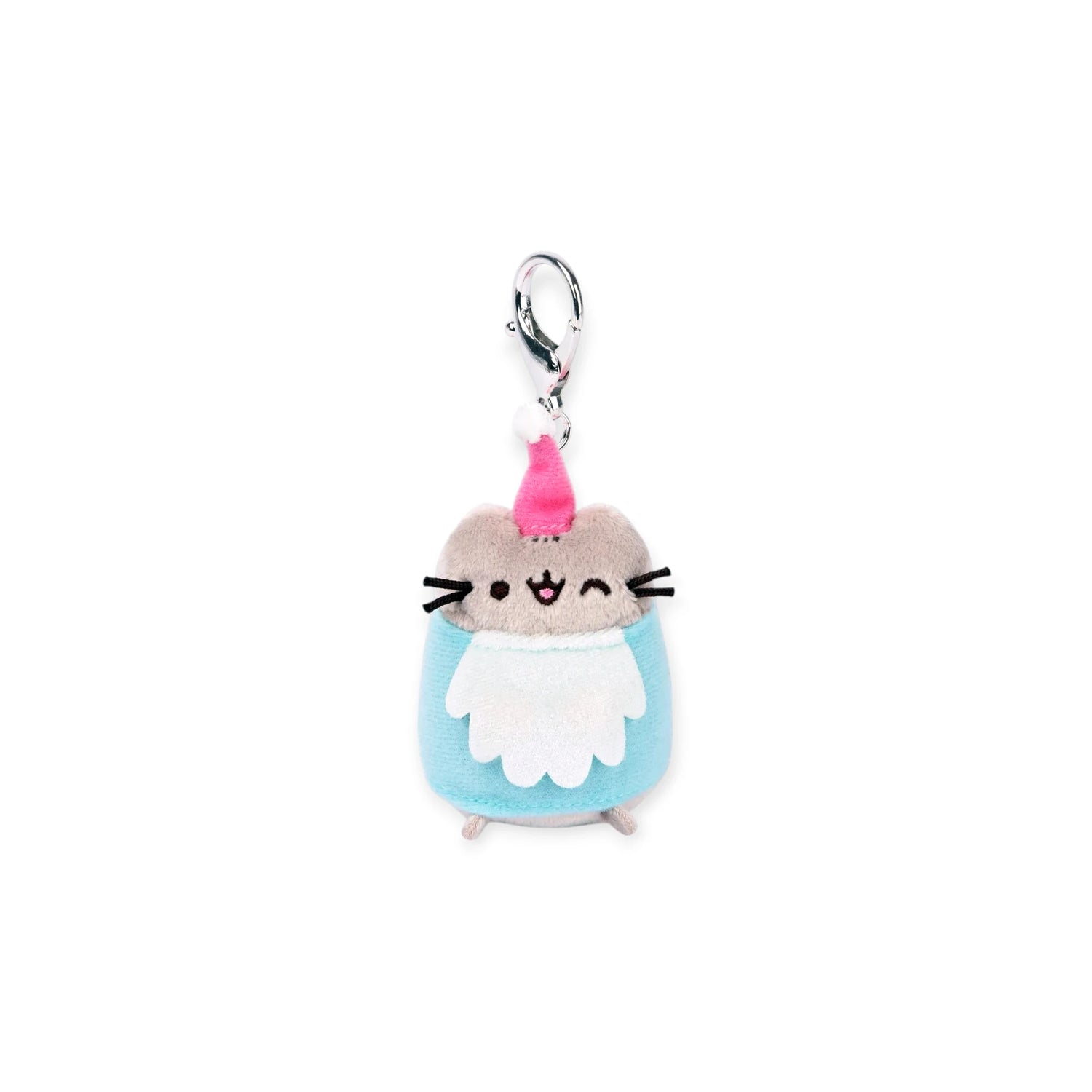The Pusheen Blind Box - Enchanted Forest by Pusheen features a small gray cat plush keychain in a blue outfit and pink Santa hat, complete with a metal clasp at the top.