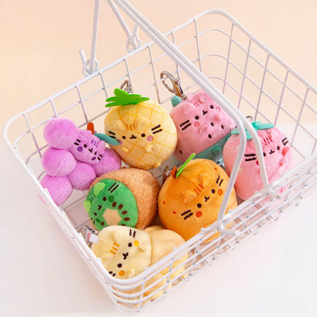 A Pusheen Blind Box - Fruits Series includes a delightful collection of fruity plush toys shaped like grapes, pineapple, and orange, each featuring cute embroidered faces. These charming collectibles are perfect for any fan of Pusheen.