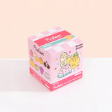 This Pusheen Blind Box - Fruits Series features delightful cartoon Pusheen cats dressed as fruity plush treats, including a pineapple, strawberry, and watermelon. With "Fruits" branding by Pusheen on the sides, it serves as the perfect Collectible Keyring for fans of whimsical charm.