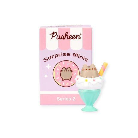 The Pusheen Delicious Desserts blind box features an adorable vinyl mini figure of a brown Pusheen cat in an ice cream sundae, part of the Pusheen Desserts Series. It comes packaged in a pink "Pusheen Surprise Minis Series 2" box.