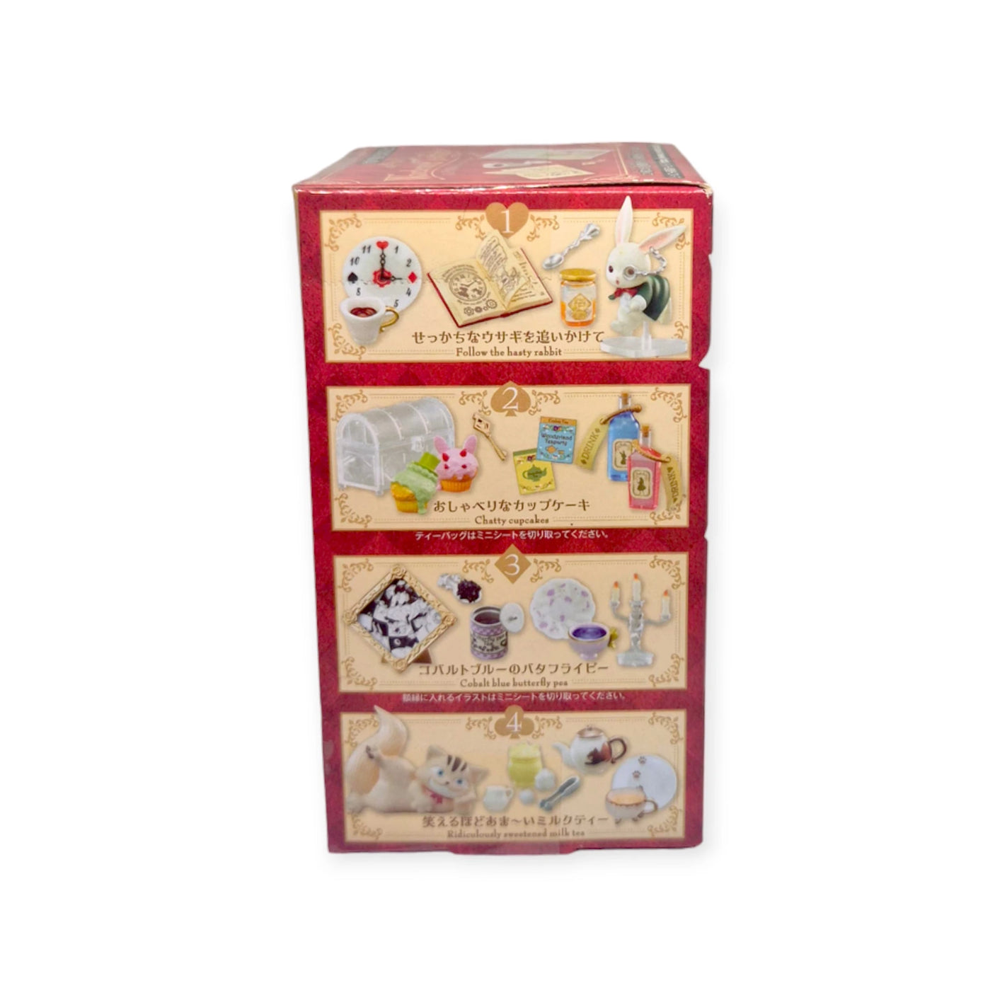 The Re-Ment Wonderland Tea Party Series features a red box with four labeled sections that unveil intricate scenes from the Wonderland Tea Party, complete with rabbit-themed miniature collectibles, small objects, and charming figurines.