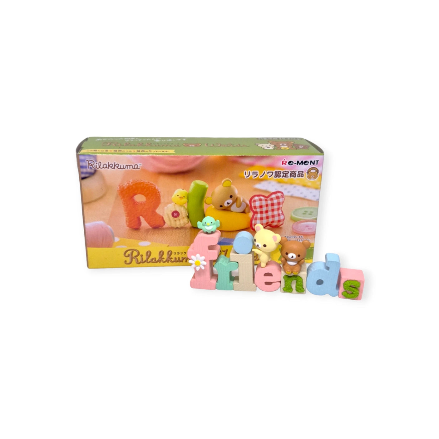 Uncover the delightful Rilakkuma Words Blind Box by Re-Ment, showcasing charming bear characters and colorful letters posed in front of the packaging.