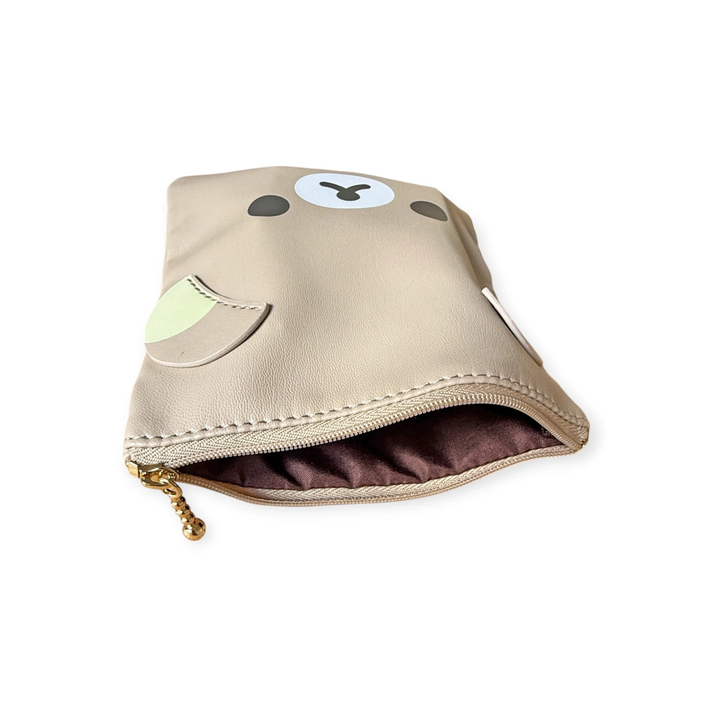 The Rilakkuma Flat Pouch - 15cm, designed with a cartoon bear motif, is spacious and versatile, featuring a secure zip closure.