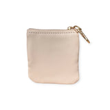 The Rilakkuma 9cm beige coin pouch is crafted from synthetic leather and features a gold zipper on top, along with a convenient keychain attachment.