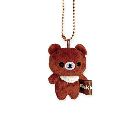 The Rilakkuma - Chairoikoguma Mini Plush Keychain features a small, soft brown bear design with a white belly. It hangs from a metallic chain and includes a tag with the brand's label partially visible on the side.