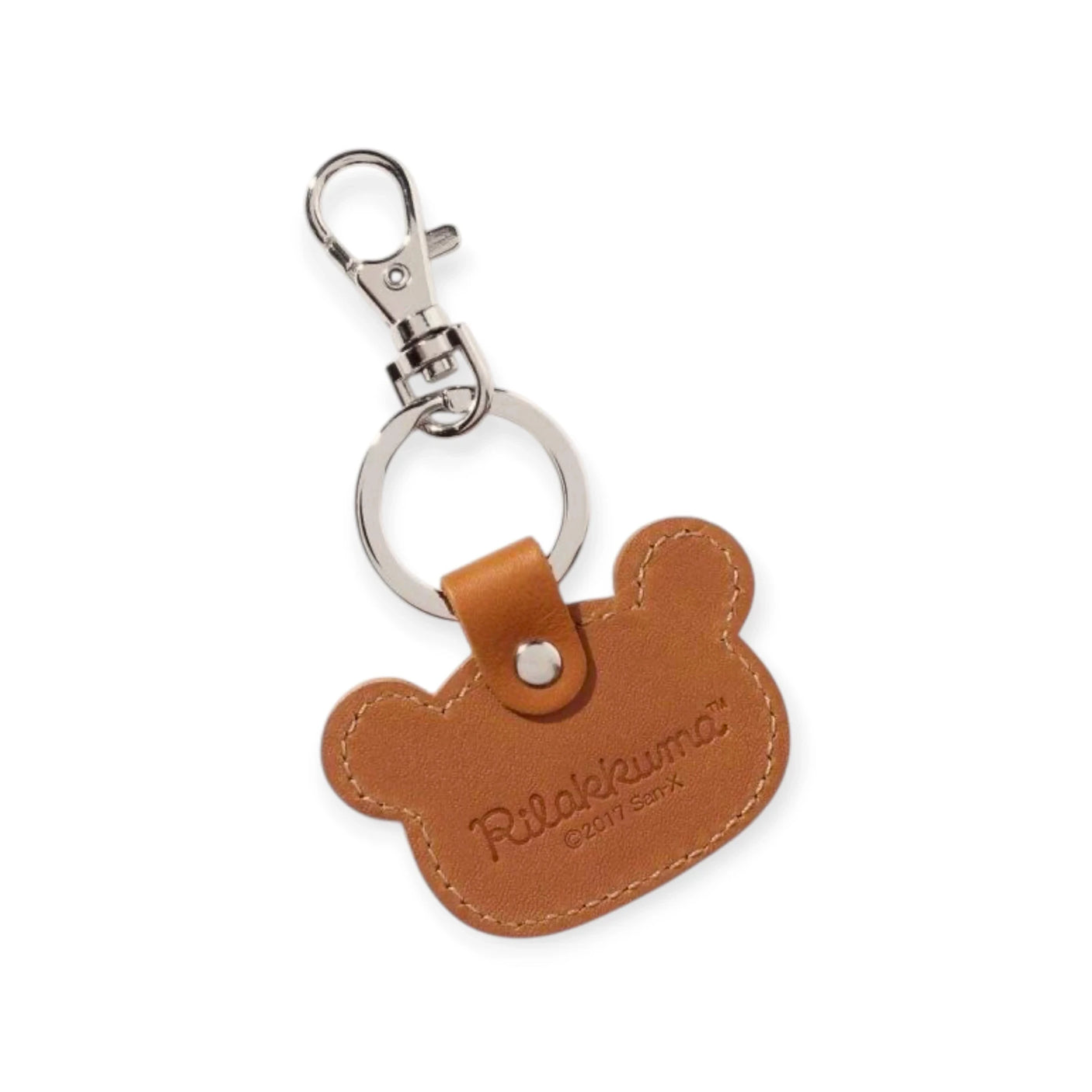 The Rilakkuma Leather Keychain is a charming, expertly crafted brown bear-shaped accessory made in Japan, featuring a sturdy metal clasp and embossed with "Rilakkuma™ © 2017 San-X," adding whimsy to your daily essentials.