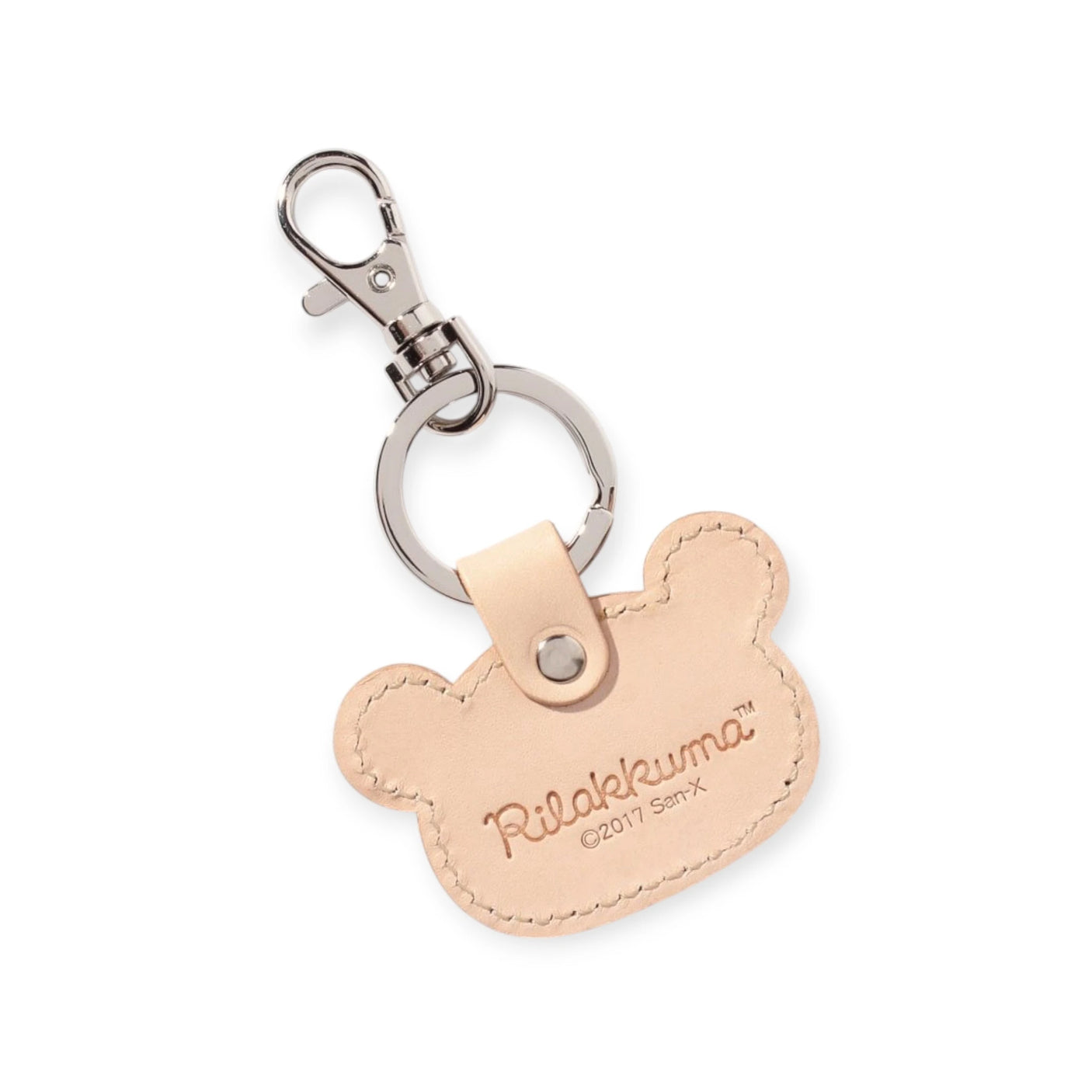 The Korilakkuma leather keychain by Rilakkuma is a beautiful Japanese-crafted accessory in beige, shaped like a bear. It features a durable metal clip and bears the "Rilakkuma" stamp with "©2017 San-X," making it perfect for adding charm to your keys.