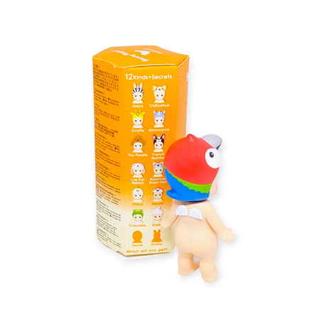 A colorful fish-headed toy figurine stands beside an orange blind box featuring various designs from the Sonny Angel Animal Version 3 Series, making it perfect for fans of collectible figures from the Sonny Angel brand.